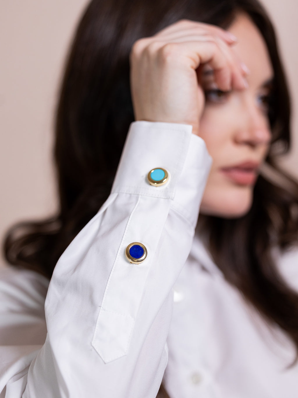 Lapus lazuli and gold button cover on white shirt.