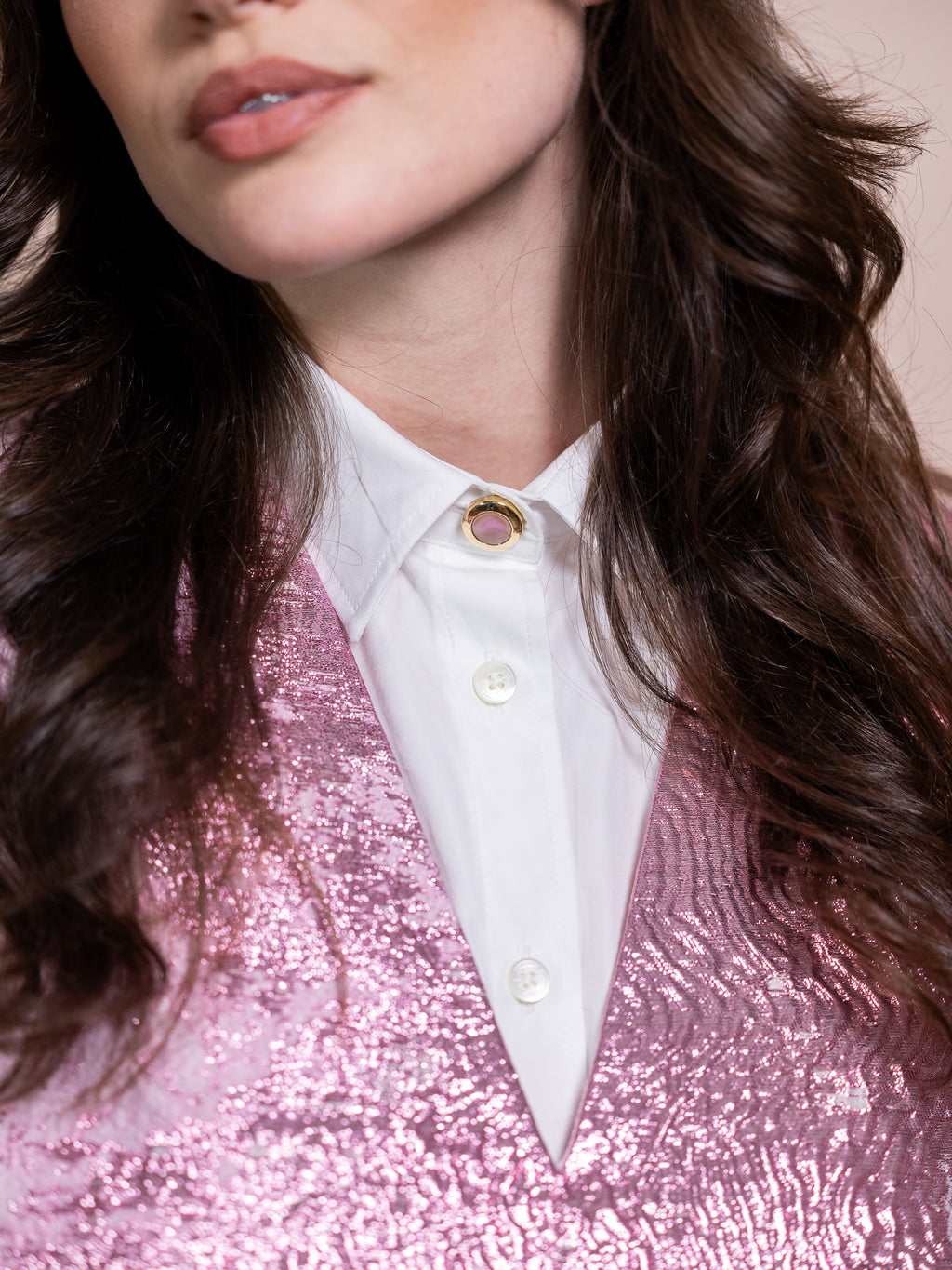 Pink mother of pearl and gold button cover on white shirt