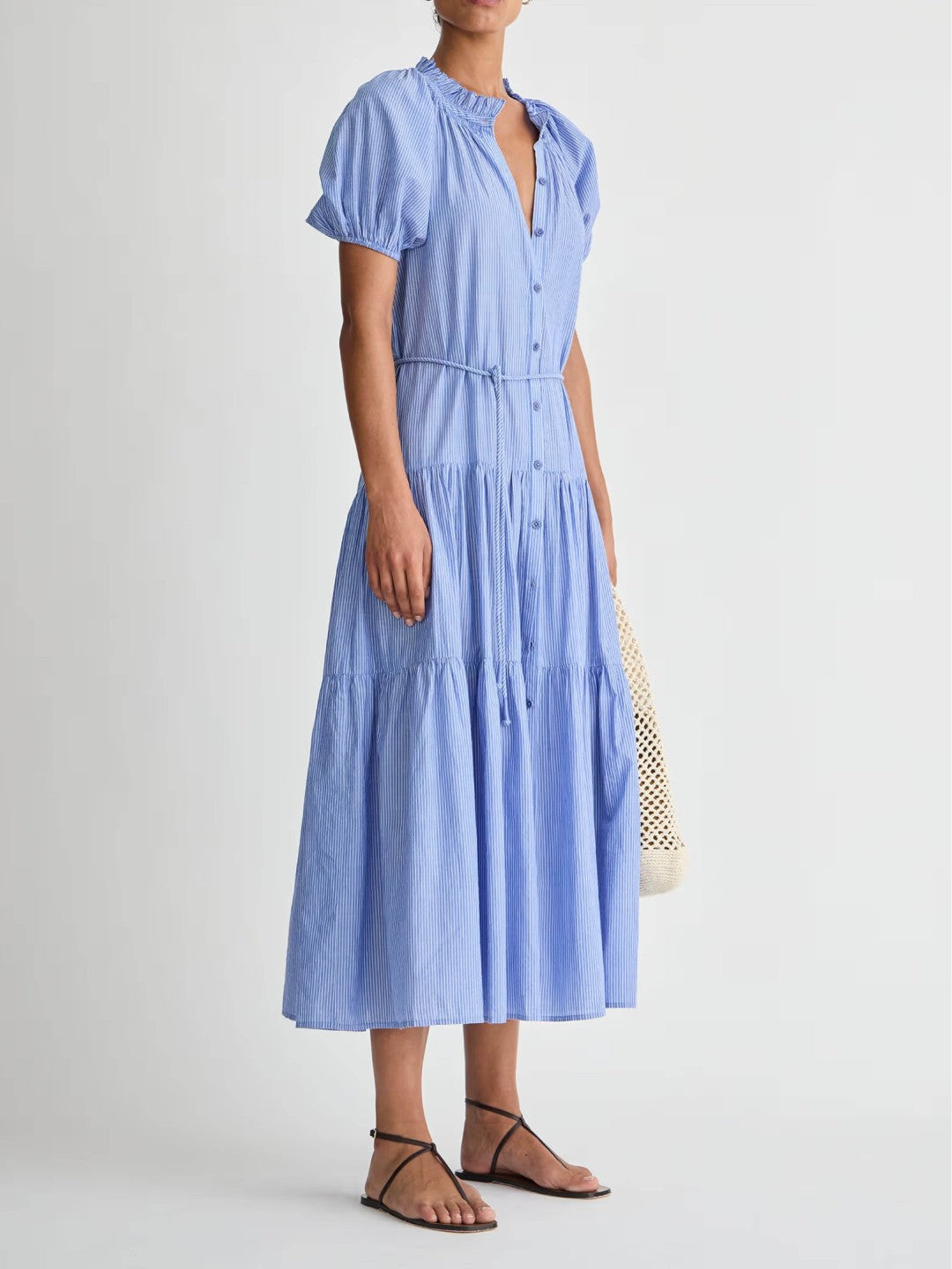 Woman wearing a blue dress on a white background